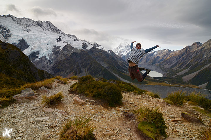 Hiker jumps for joy at the Sealy Tarns, Mt Cook / Aoraki National Park