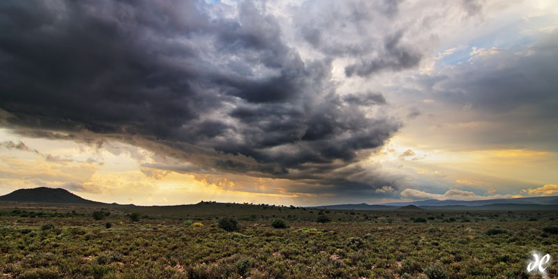 Thunder clouds and god beams in the Great Karoo Desert, South Africa