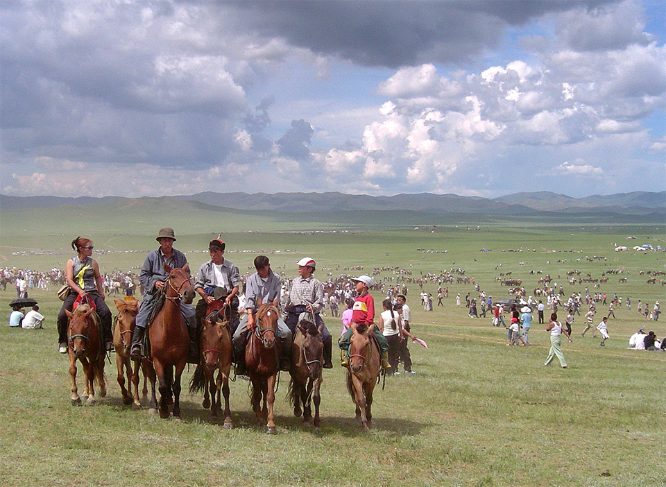 Mongolian horse riders in the steppe