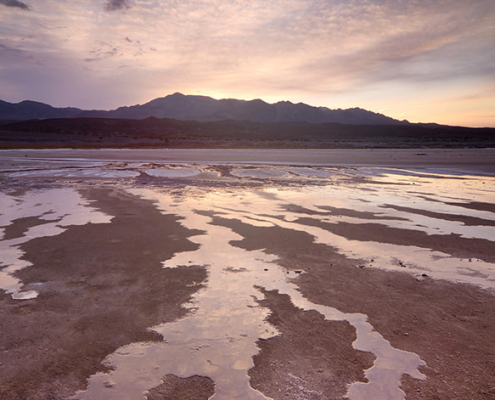 Water runoff at sunrise in the Cottonball Basin, Death Valley National Park