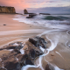 four-mile-beach-santa-cruz-rocks-waves-sunset