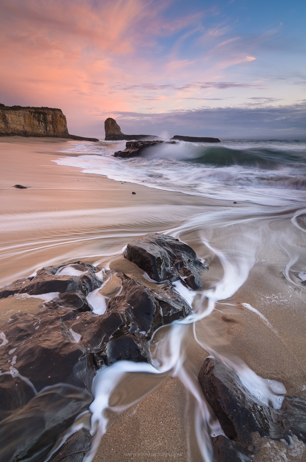 four-mile-beach-santa-cruz-rocks-waves-sunset